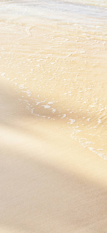 Beach and white waves 4k phone wallpaper