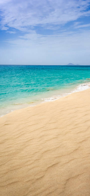 Delicate beach, clear blue sea 4k phone wallpaper