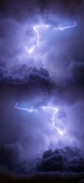 lightning strike through purple clouds 4K phone wallpaper