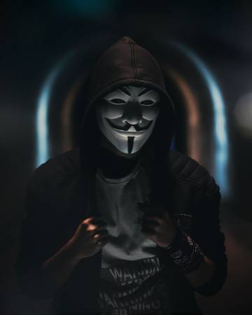 mysterious anonymous figure in dark hoodie phone wallpaper