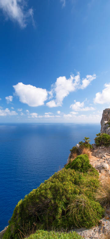 blue sea clear sky rocky cliff phone wallpaper