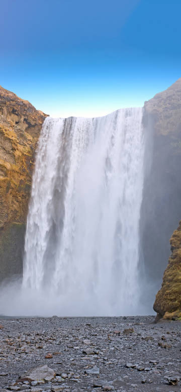 Spectacular waterfall in the blue sky phone wallpaper