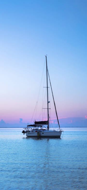 Beautiful Boat In A Turquoise Lagoon 4K Phone Wallpaper