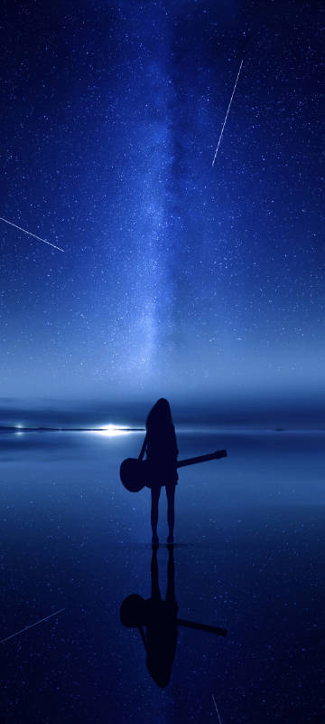 Girl holding guitar under the starry sky phone wallpaper