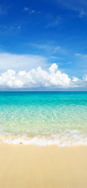 Blue sky, white clouds, clear sea water, beach scenery phone wallpaper