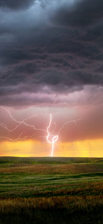 Bright lightning under dark clouds scenic phone wallpaper