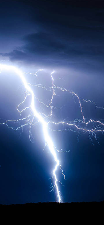 Bright lightning in the night sky scenic phone wallpaper