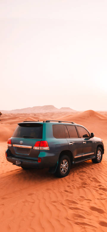Toyota SUV Car On Brown Sand 4K Phone Wallpaper