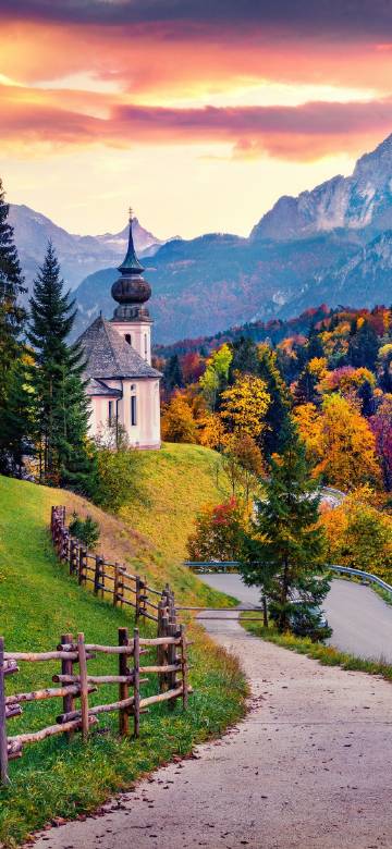 Autumn scenery of a small church on the hillside