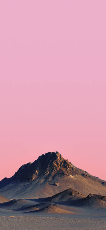 A lone mountain stands in the desert