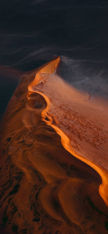 The graceful curves and fine textures of sand dunes
