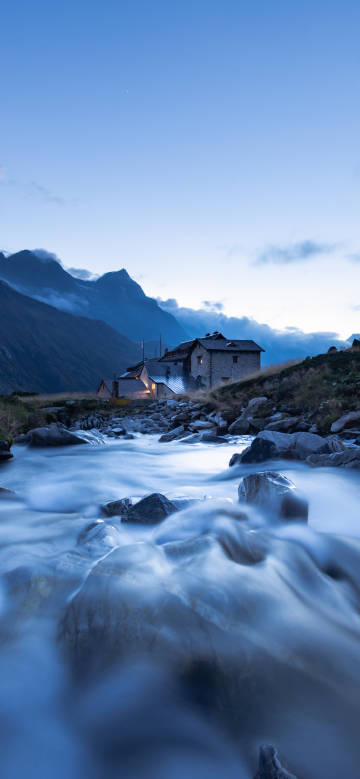 Views of mountain huts, rushing streams and distant mountains