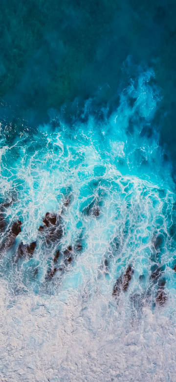 Blue-green waves lapping at the shore