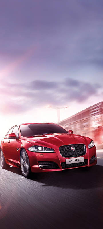 High-performance red Jaguar on the road