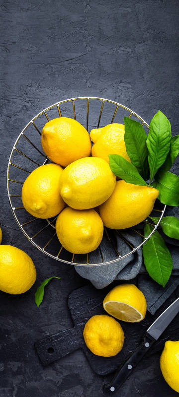 A basket of fresh lemons phone wallpaper