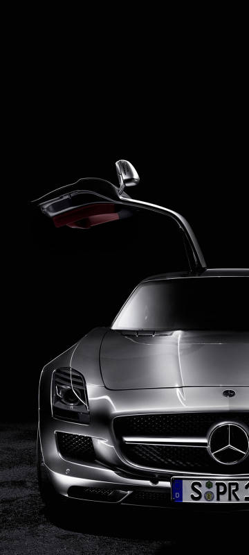 Silver Mercedes Benz sports car with open doors phone wallpaper