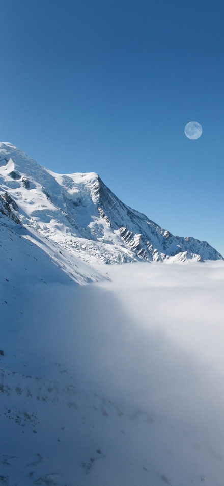Towering snow-capped mountains and blue sky phone wallpaper