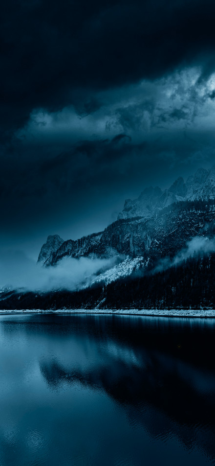 Mountains and lake reflections in gloomy weather