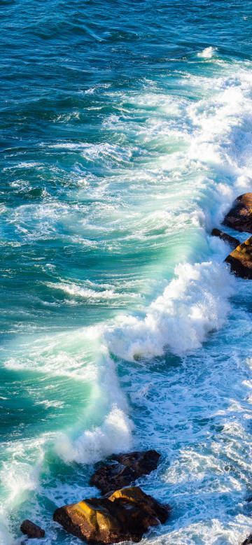 Turquoise Sea with White Waves 4K Phone Wallpaper