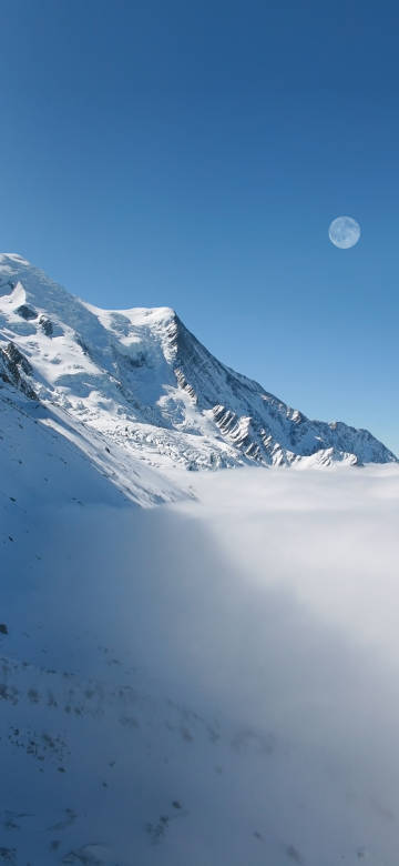 Towering snow-capped mountains and blue sky phone wallpaper
