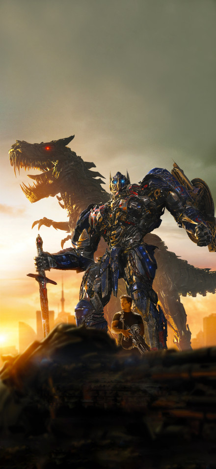 Optimus Prime Standing With A Dragon At Sunset
