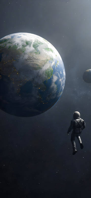 Astronauts floating in space looking at the Earth wallpaper