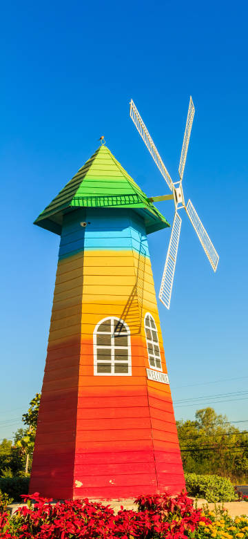 Colorful Rainbow Windmill Under Blue Sky 4K Phone Wallpaper