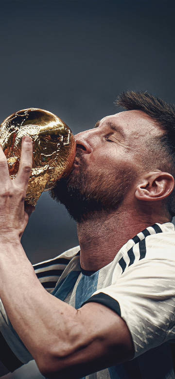 Messi passionately kissing the FIFA World Cup Trophy 4K Wallpaper