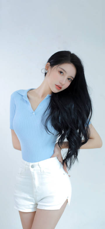 Long-haired beauty blue sweater white shorts phone wallpaper