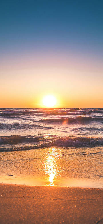 Scenic View of Ocean During Sunset 4K Phone Wallpaper