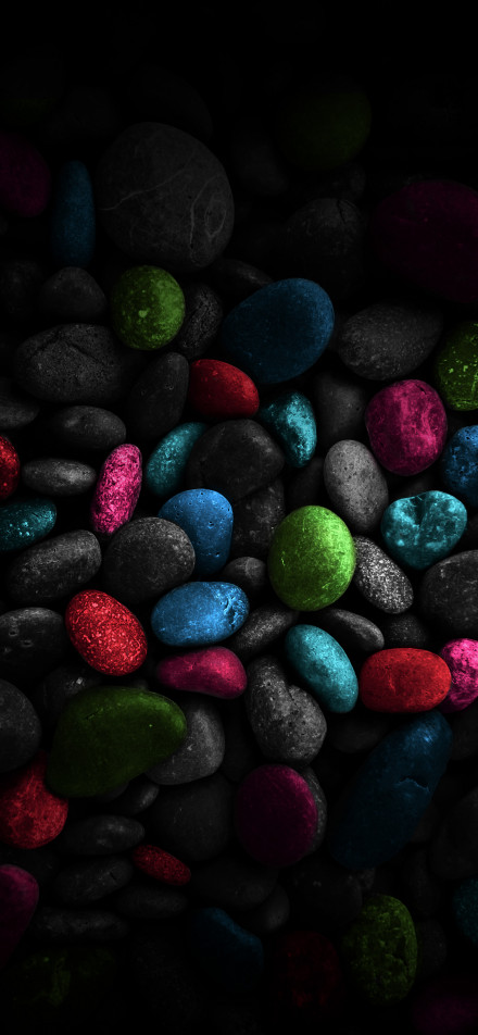 Stones of various colors on a black background phone wallpaper