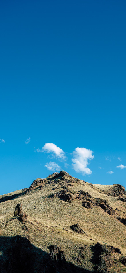 Mountains of natural beauty under a blue sky