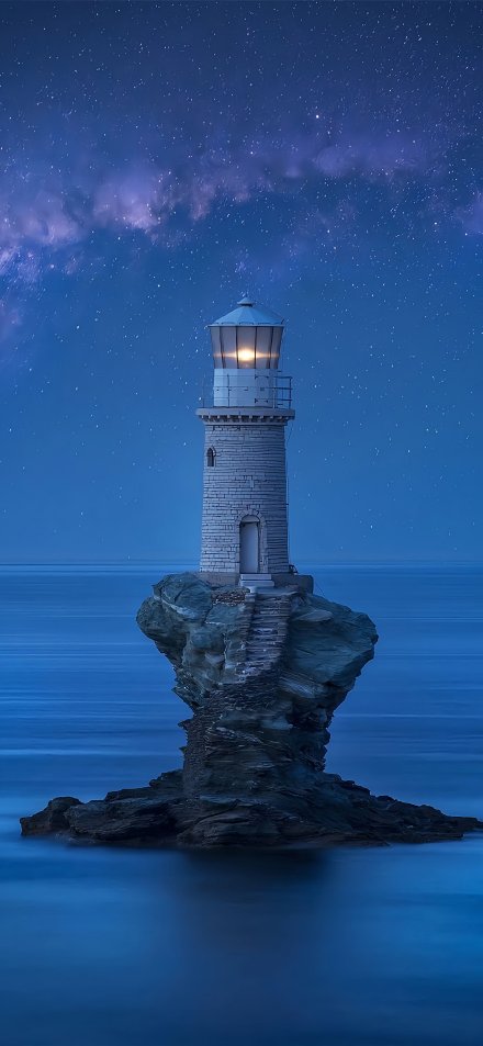 Lonely Lighthouse on a Rock Under Starry Sky 4K UHD Wallpaper