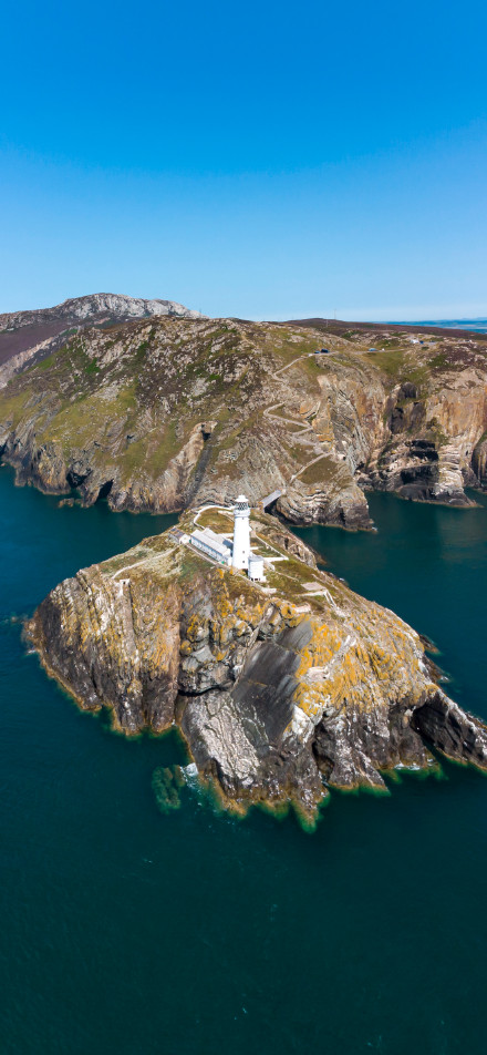 Aerial View of Seaside Lighthouse Phone Wallpaper