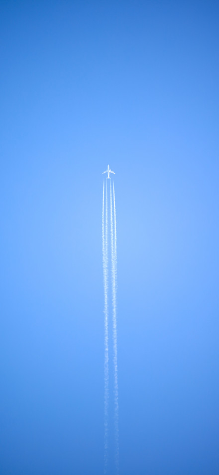 Airplane flying in the clear blue sky phone wallpaper