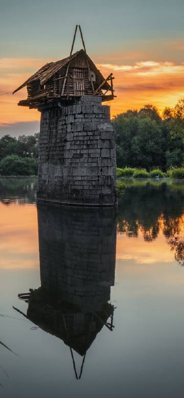 Remains of ancient buildings standing on the water