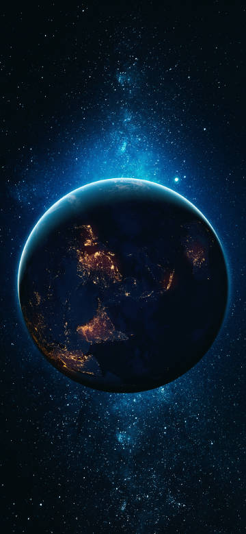 Earth suspended in space illuminated by city lights