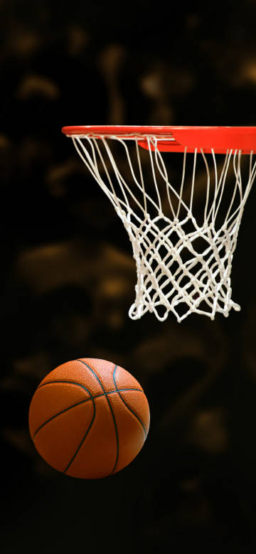 The moment the basketball enters the basket