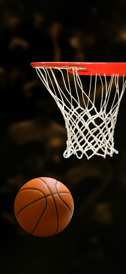 The moment the basketball enters the basket