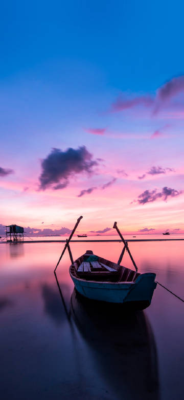 Small Boat under the Pink - purple Sky