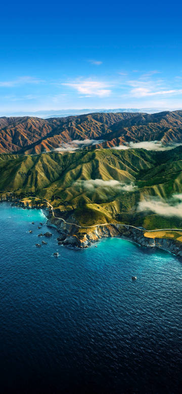 Mountains against the Blue Sky and Clear Sea