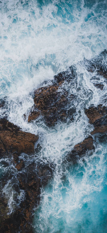 Collision of Waves and Reefs