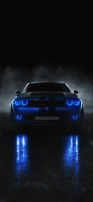 Sports car with blue lights on at night