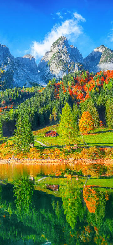 Colorful lake scenery under blue sky and white clouds