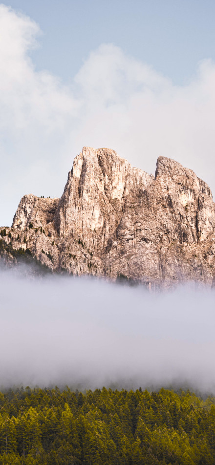 Clouds Wrapping around the Steep Mountain