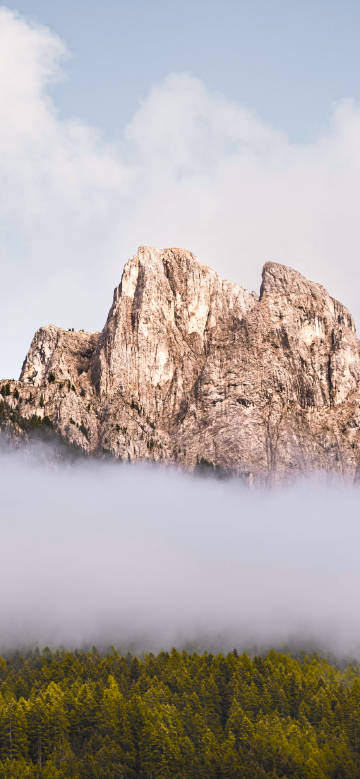 Clouds Wrapping around the Steep Mountain