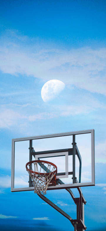 A bright moon on the basketball hoop