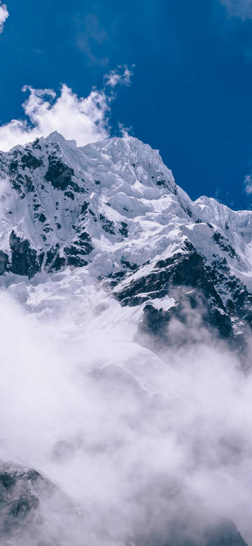 Clouds Wrapping around the Snowy Mountain Peak