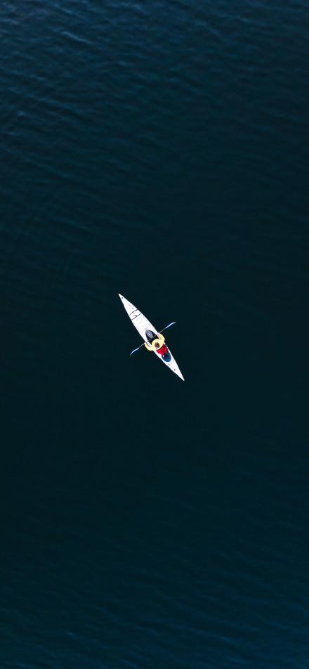 Overlooking the single rowing boat on the river