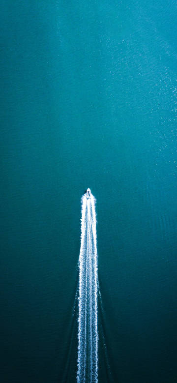 Overlooking the boat moving fast on the sea